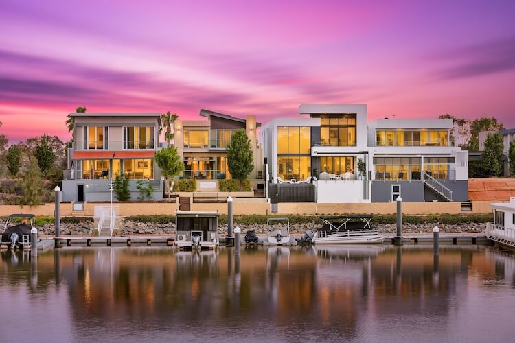 Exterior twilight real estate photography of riverfront apartments